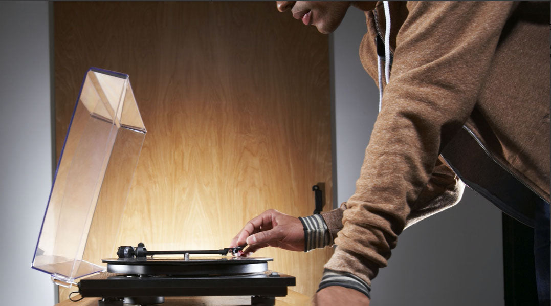 FAQ banner man playing record